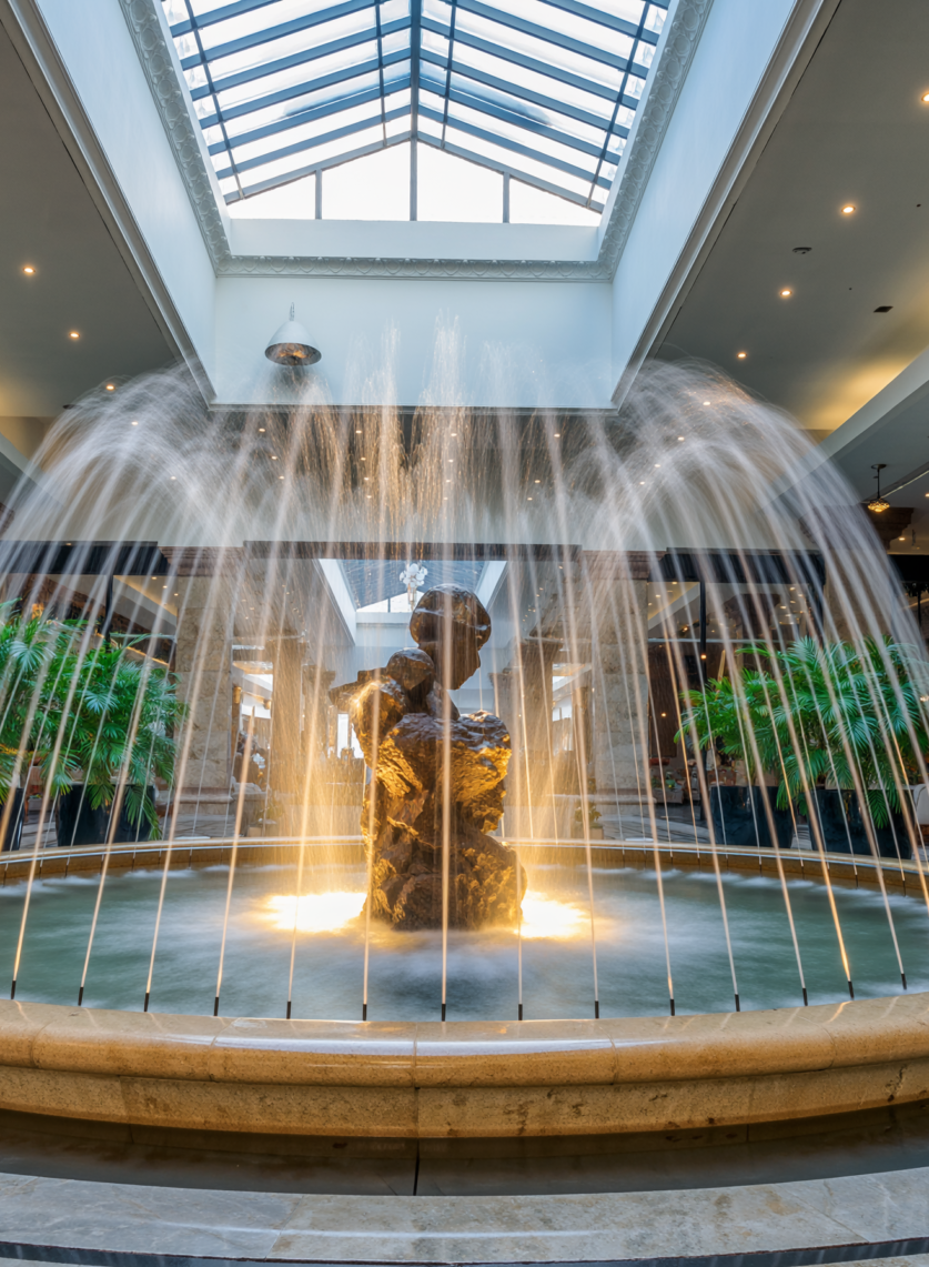 Firefly_A photorealistic interior photograph of a contemporary, sculptural water fountain cen 96486